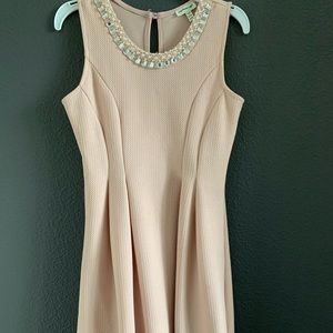 Weekend afternoon dress, bejeweled around the neck and patterned on the bottom.